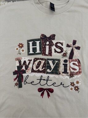 Hand Crafted cream graphic tee with burgundy and green accents